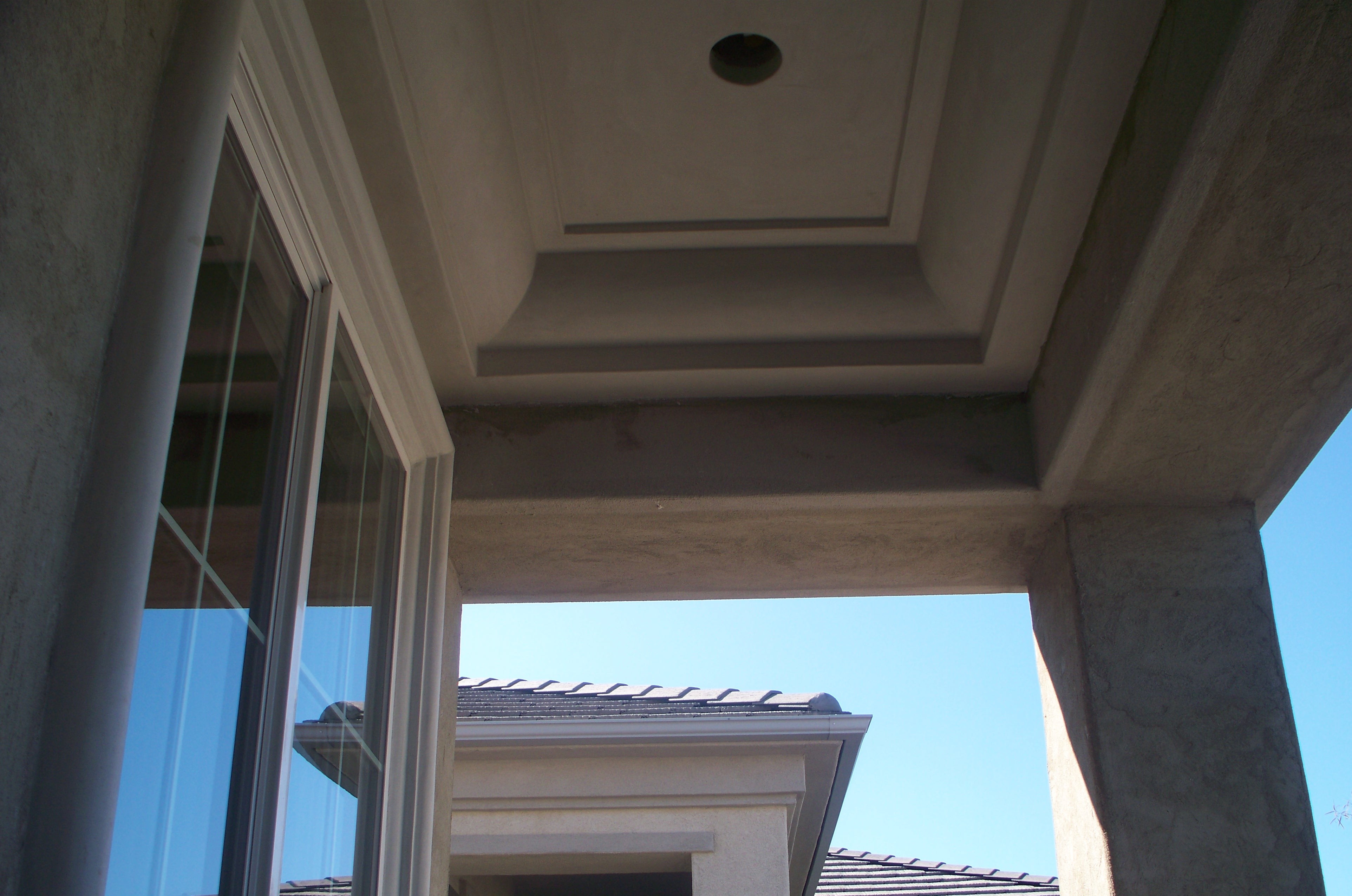 CUSTOM EXTERIOR SOFFIT MADE OUT OF FOAM WITH A SANTA BARBARA SMOOTH FINISH.
